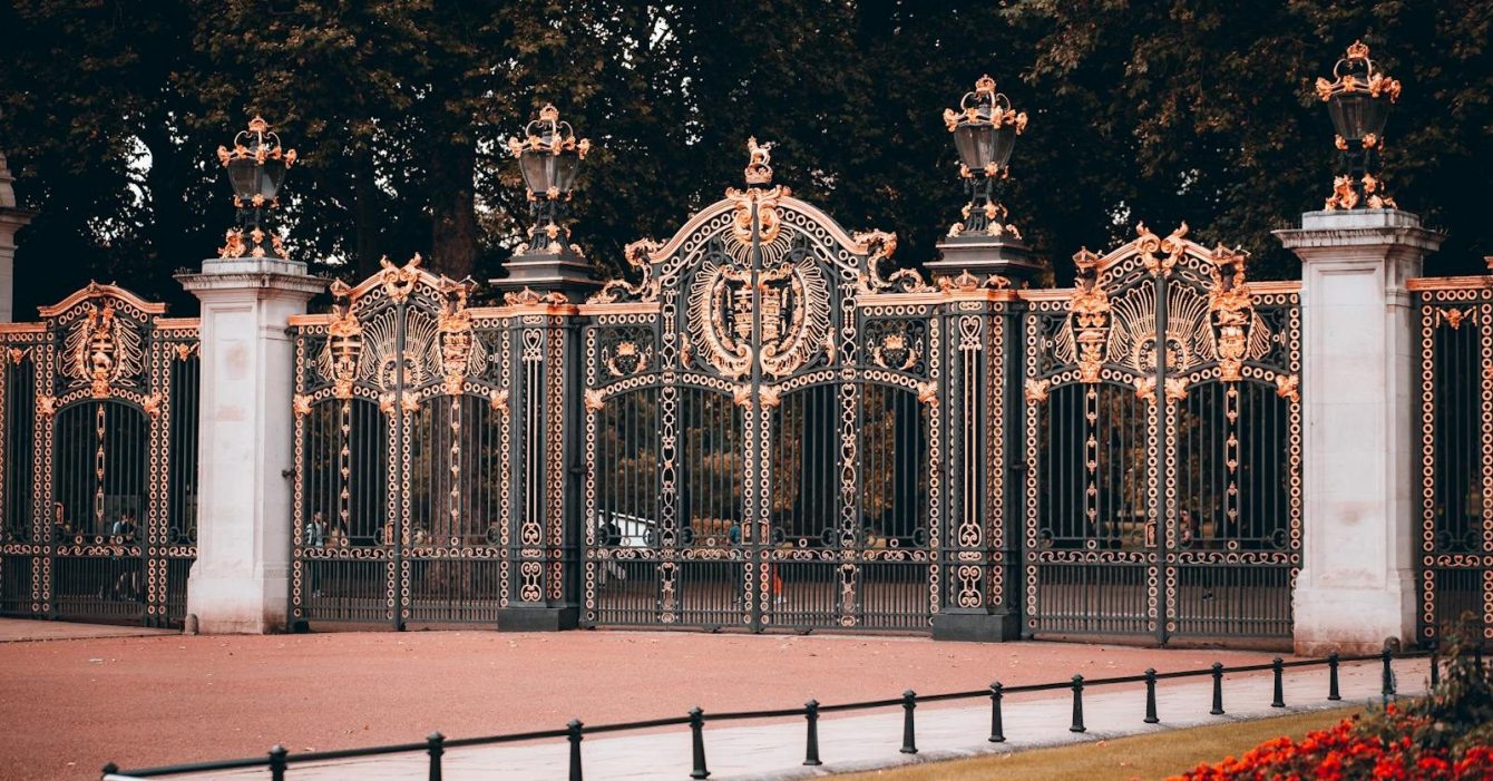 Photo by Szymon Shields Stunning view of the ornate gates of Buckingham Palace, London.